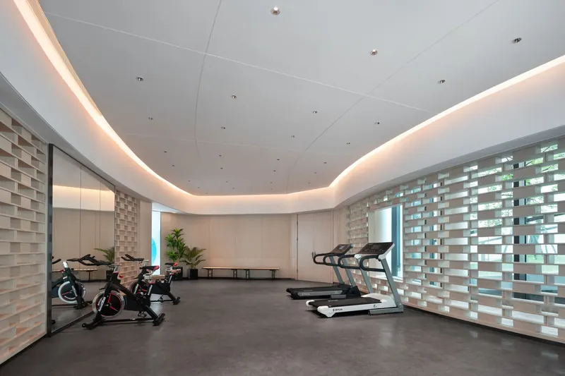 Spacious gym with modern fitness equipment and stylish decor